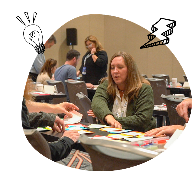 Participants collaborating with sticky notes during a workshop.